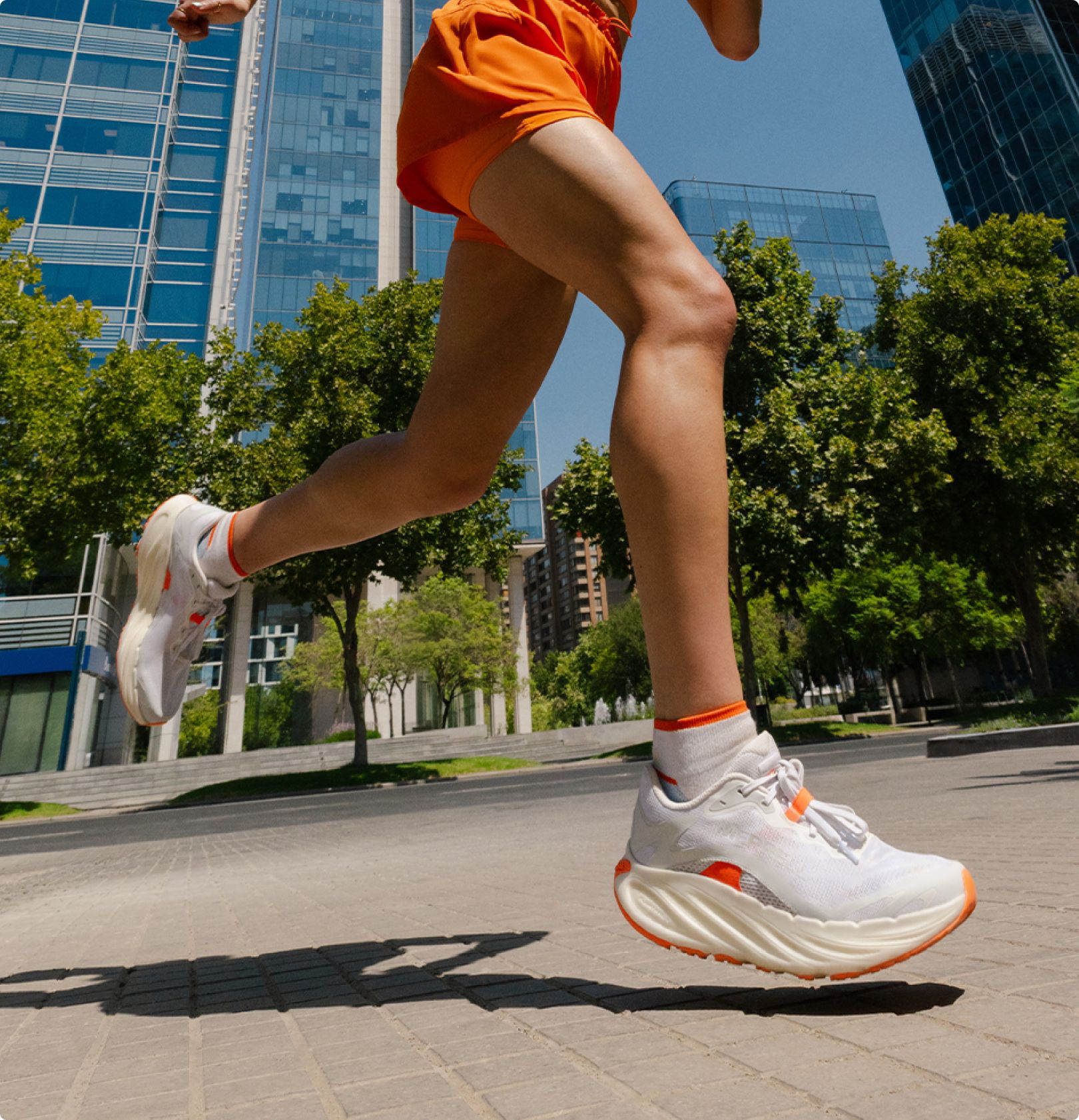 Person running wearing Merell PromMorph shoes.